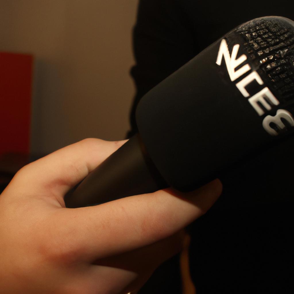 Person holding a news microphone